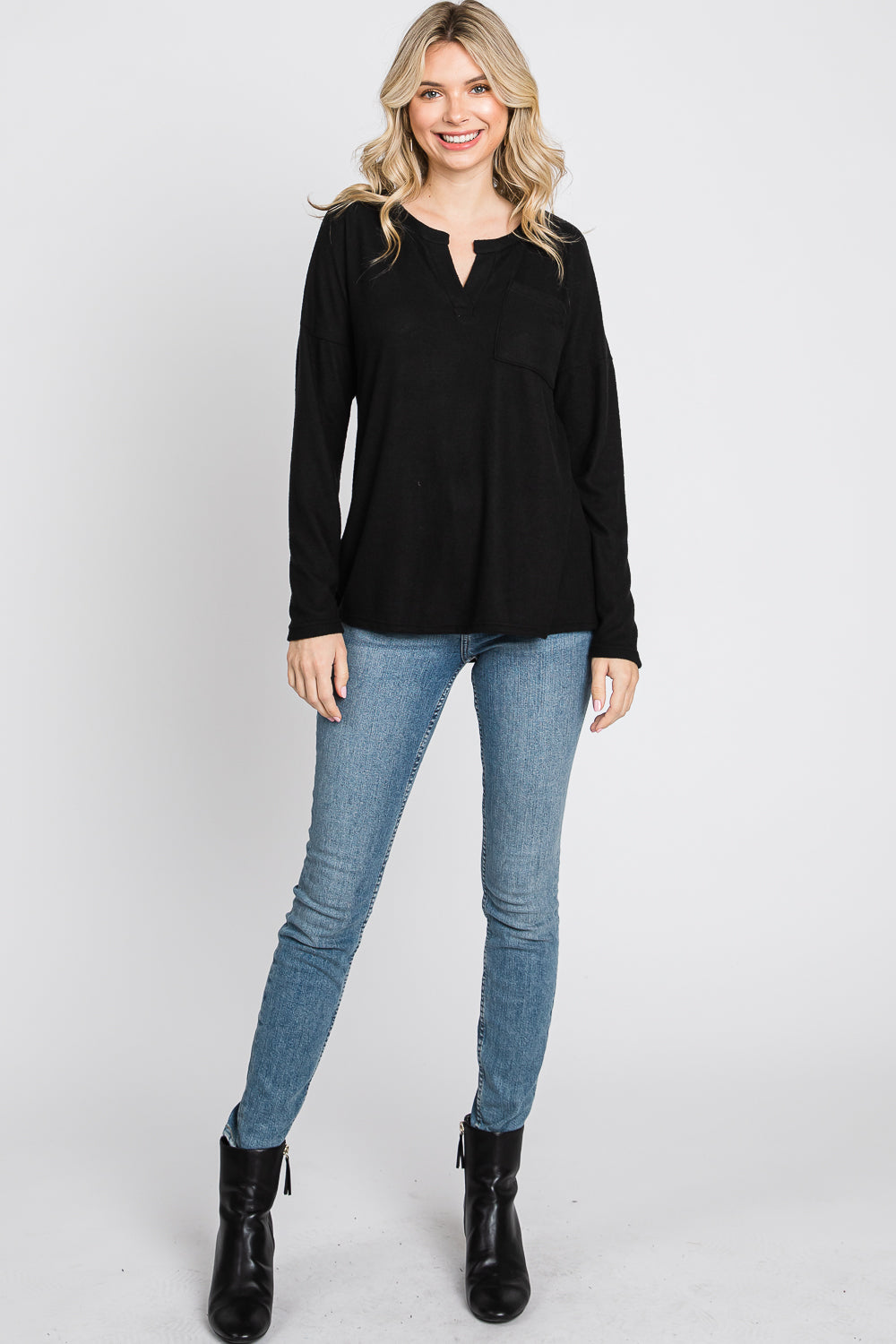 Long sleeve pocket hi low knit black top