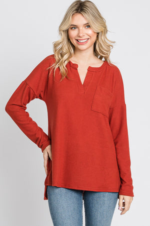 Long sleeve pocket hi low knit rust top